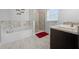 Bathroom with soaking tub, walk-in shower, and granite vanity at 5826 Sw 83Rd Ln, Ocala, FL 34476