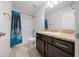 Clean bathroom with dark vanity and tile flooring at 5826 Sw 83Rd Ln, Ocala, FL 34476