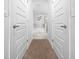 View down hallway to a large bathtub and shower at 5826 Sw 83Rd Ln, Ocala, FL 34476