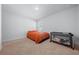 Simple bedroom with orange bedding and a crib at 5826 Sw 83Rd Ln, Ocala, FL 34476