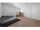 Bedroom with carpeted flooring, a bed, and a wooden desk at 5826 Sw 83Rd Ln, Ocala, FL 34476