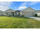 One-story home with stone accents, two-car garage, and manicured lawn at 5826 Sw 83Rd Ln, Ocala, FL 34476