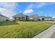 One-story home with stone accents, two-car garage, and manicured lawn at 5826 Sw 83Rd Ln, Ocala, FL 34476