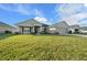One-story home with stone accents, two-car garage, and manicured lawn at 5826 Sw 83Rd Ln, Ocala, FL 34476
