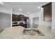 Modern kitchen with stainless steel sink and granite counters at 5826 Sw 83Rd Ln, Ocala, FL 34476
