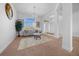 Bright and airy living room with large window and chandelier at 5826 Sw 83Rd Ln, Ocala, FL 34476