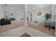 Open living room with neutral carpeting and ample natural light at 5826 Sw 83Rd Ln, Ocala, FL 34476