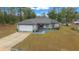 House with driveway and yard, aerial view at 6 Bahia Course Way, Ocala, FL 34472