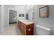 Bathroom features a double vanity and granite countertops at 6 Bahia Course Way, Ocala, FL 34472