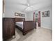 Primary bedroom with a king-size bed and tile floor at 6 Bahia Course Way, Ocala, FL 34472