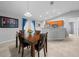 Dining room features a wood table and chairs, near kitchen at 6 Bahia Course Way, Ocala, FL 34472