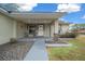 Front porch with covered seating area and walkway at 6 Bahia Course Way, Ocala, FL 34472