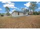 House exterior showcasing backyard and covered patio at 6 Bahia Course Way, Ocala, FL 34472