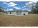 House exterior showcasing backyard and covered patio at 6 Bahia Course Way, Ocala, FL 34472
