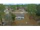 Backyard view of house with covered patio at 6 Bahia Course Way, Ocala, FL 34472