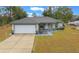 Single-story house with attached garage and landscaped yard at 6 Bahia Course Way, Ocala, FL 34472