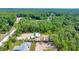 Aerial view of homes under construction nestled in a lush, treed community at 6877 Sw 131St Cir, Ocala, FL 34481