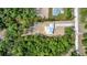 Aerial view of a new home and treed lot with red outline of property at 6877 Sw 131St Cir, Ocala, FL 34481