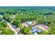 Aerial view of homes under construction on wooded lots in a rural community at 6877 Sw 131St Cir, Ocala, FL 34481