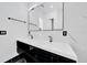Modern bathroom vanity with dual sinks, sleek fixtures, and a large mirror for added convenience at 6877 Sw 131St Cir, Ocala, FL 34481