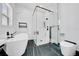 Sleek bathroom featuring modern fixtures, including a frameless glass shower and a soaking tub at 6877 Sw 131St Cir, Ocala, FL 34481