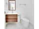 Modern bathroom showcasing wood vanity and sleek fixtures at 6877 Sw 131St Cir, Ocala, FL 34481
