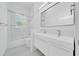 Clean bathroom featuring a modern vanity with double sinks and a shower-tub combination at 6877 Sw 131St Cir, Ocala, FL 34481
