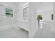 Modern bathroom featuring bright vanity with sleek double sinks and shower-tub combination at 6877 Sw 131St Cir, Ocala, FL 34481