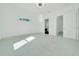 Bright bedroom with white walls and modern doors showcasing the home's contemporary design at 6877 Sw 131St Cir, Ocala, FL 34481