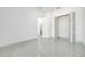 Minimalist bedroom featuring sleek floors and modern fixtures at 6877 Sw 131St Cir, Ocala, FL 34481