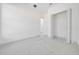 Modern bedroom with a closet and bright white tile flooring at 6877 Sw 131St Cir, Ocala, FL 34481