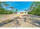 Home exterior highlighting its serene setting at 6877 Sw 131St Cir, Ocala, FL 34481