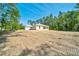 Home exterior showcasing its tranquil setting and design at 6877 Sw 131St Cir, Ocala, FL 34481