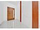 Hallway view featuring elegant floors and wood accents at 6877 Sw 131St Cir, Ocala, FL 34481