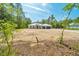 Exterior view of home with a well-manicured lawn and ample natural light at 6877 Sw 131St Cir, Ocala, FL 34481