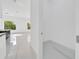 Hallway leading to an open concept living area with a modern storage space at 6877 Sw 131St Cir, Ocala, FL 34481