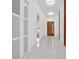 Contemporary hallway with sleek floors and modern design elements at 6877 Sw 131St Cir, Ocala, FL 34481