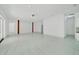 Open-concept living area with tile flooring and modern accents for seamless entertaining at 6877 Sw 131St Cir, Ocala, FL 34481