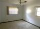 Neutral bedroom with ample natural light, ceiling fan, and clean, minimalist design at 691 Se 19Th St, Ocala, FL 34471