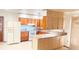 Bright eat-in kitchen features granite counters, modern appliances, and breakfast bar at 691 Se 19Th St, Ocala, FL 34471