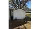 This backyard features a white shed, providing ample outdoor storage on a well-maintained lawn at 691 Se 19Th St, Ocala, FL 34471