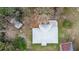 Aerial view of a house with metal roof and surrounding trees at 70 Se 81St Pl, Ocala, FL 34480
