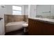 Bathroom with tub, toilet, and granite countertop at 70 Se 81St Pl, Ocala, FL 34480