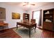 Home office with wood flooring and built-in shelving at 70 Se 81St Pl, Ocala, FL 34480