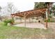 Open-air carport structure with a sandy area at 70 Se 81St Pl, Ocala, FL 34480