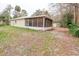 Single story home with screened porch and mature trees at 70 Se 81St Pl, Ocala, FL 34480