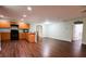 Open concept kitchen with wood cabinets and black appliances at 70 Se 81St Pl, Ocala, FL 34480