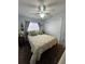 Bright bedroom with a queen bed and ceiling fan at 7632 Sw 112Th Ln, Ocala, FL 34476