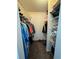 Large closet with shelving and hanging rods at 7632 Sw 112Th Ln, Ocala, FL 34476