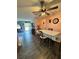 Dining area with four-person table set and view into living room at 7632 Sw 112Th Ln, Ocala, FL 34476